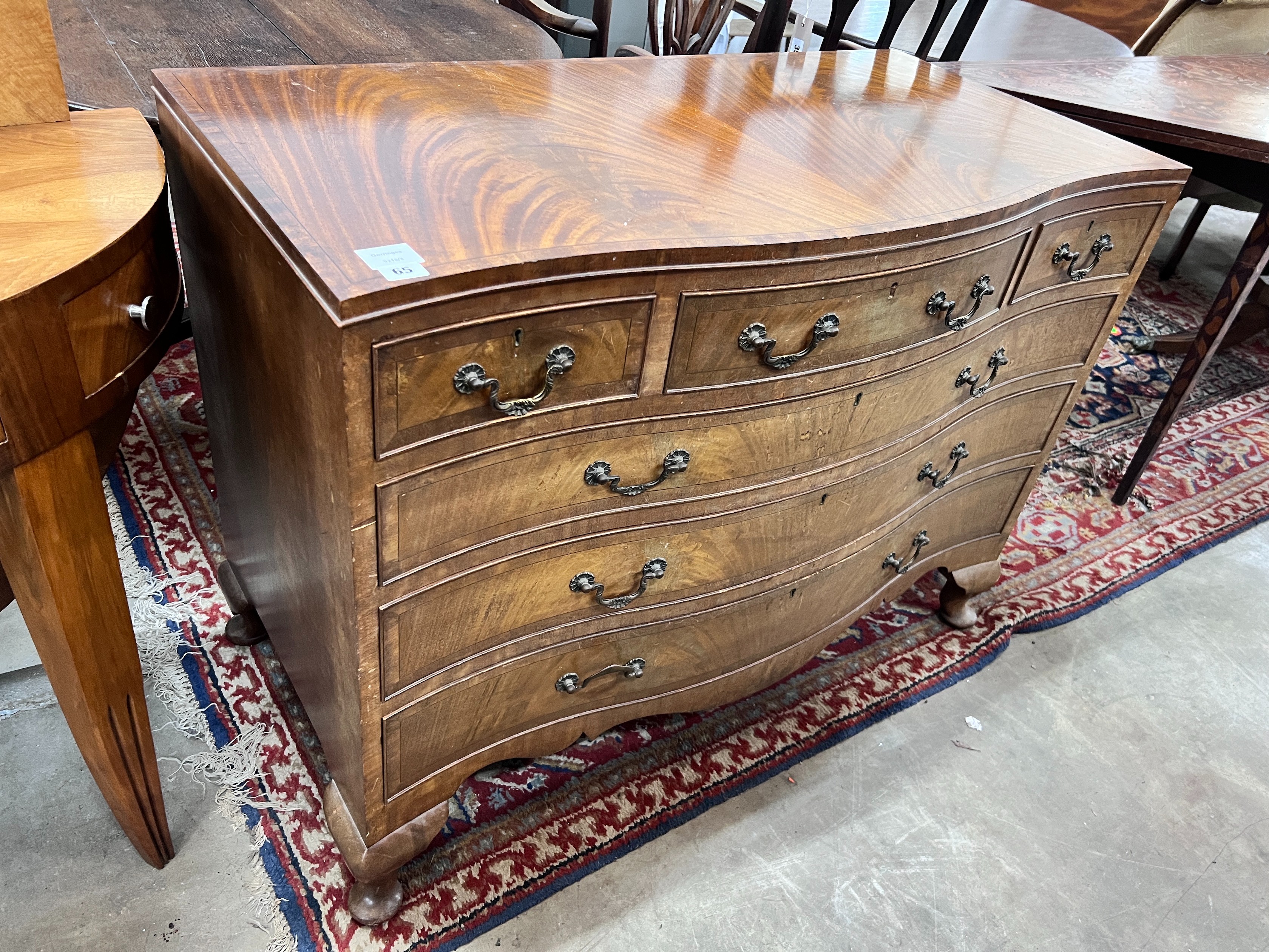 A reproduction George III style mahogany serpentine chest, width 107cm, depth 54cm, height 80cm *Please note the sale commences at 9am.